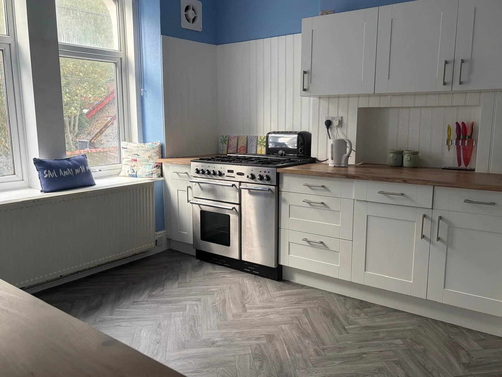 Bright self-catering kitchen inside the spacious two-bedroom apartment in Westward Ho!