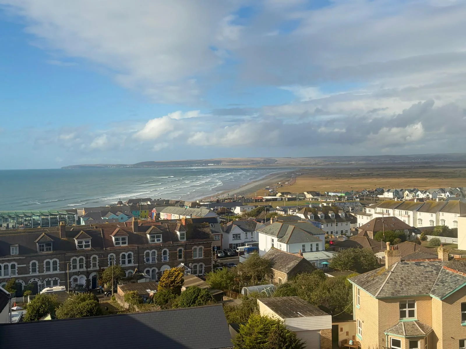 Wide view across Westward Ho! village, beach and the North Devon coast from the apartment
