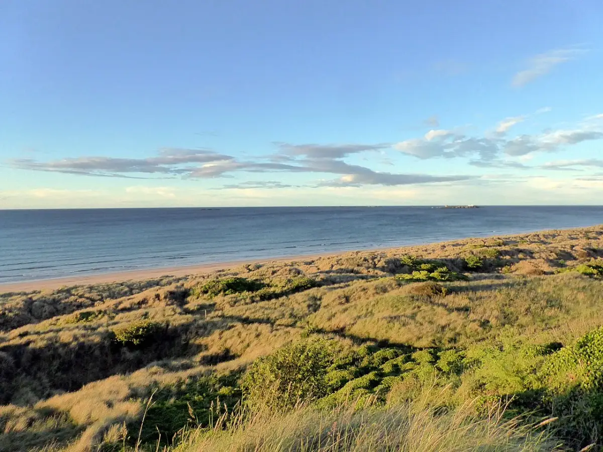 Coastal scene near Bamburgh, used as a representative image for Glebe House & Cottage