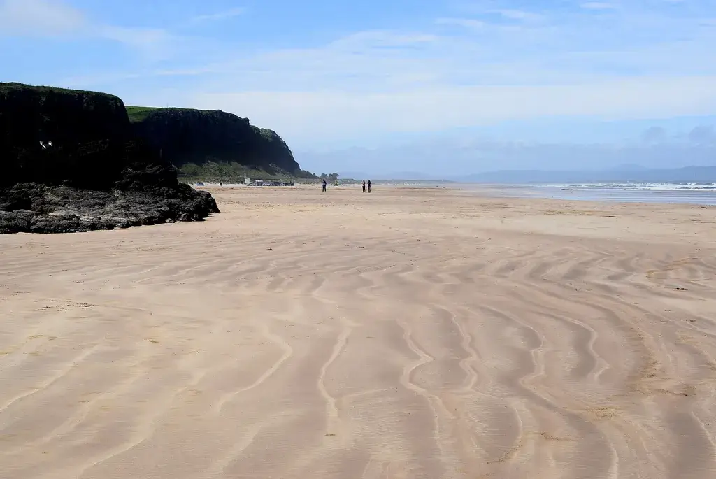 Coastal scene near Downhill Beach, used as a representative image for Railway Sleeper Hostel