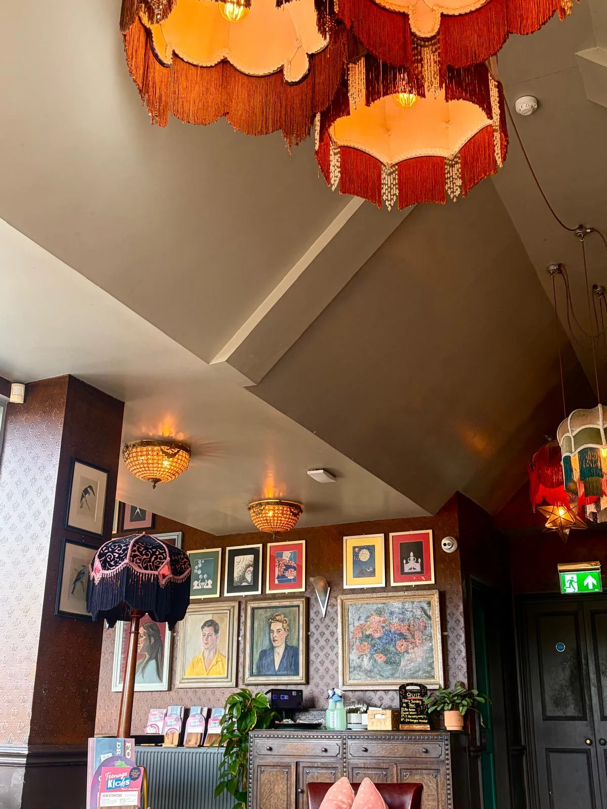 Colourful lamps and framed artwork inside Teatro Lounge