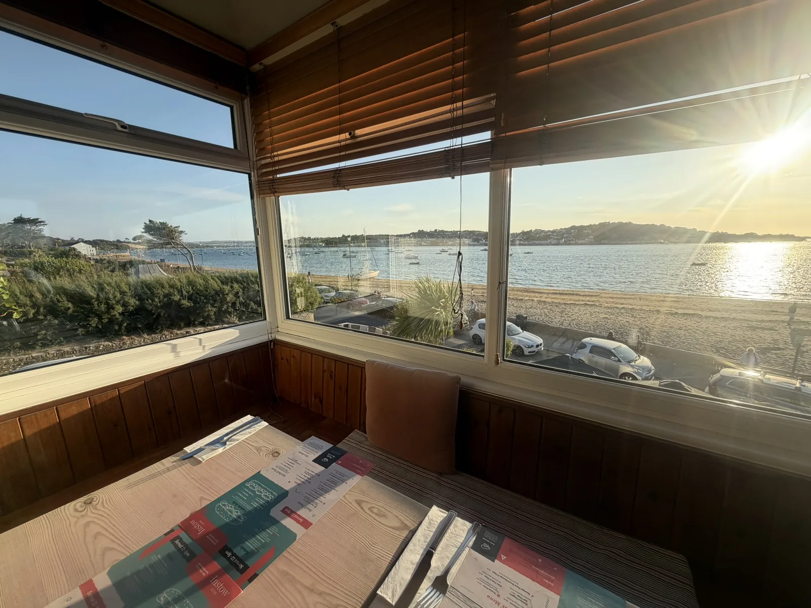 Estuary view through a front-window table at The Instow Arms