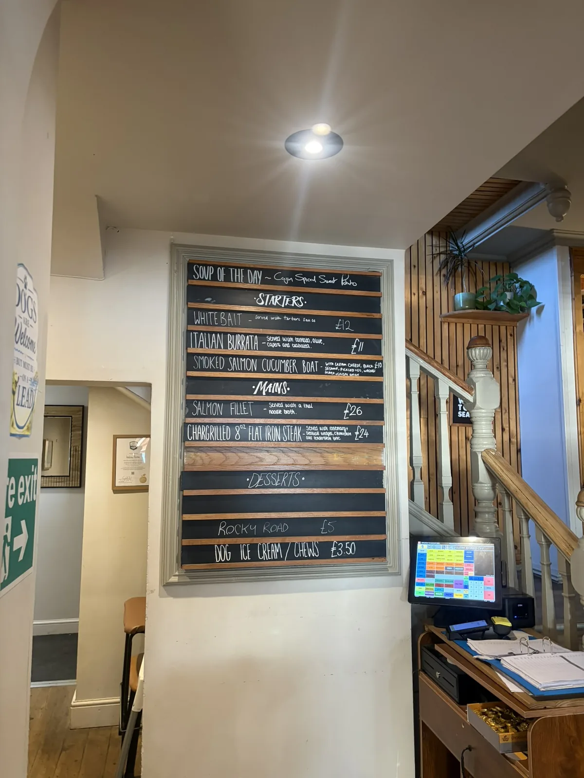 Specials board and staircase inside The Instow Arms