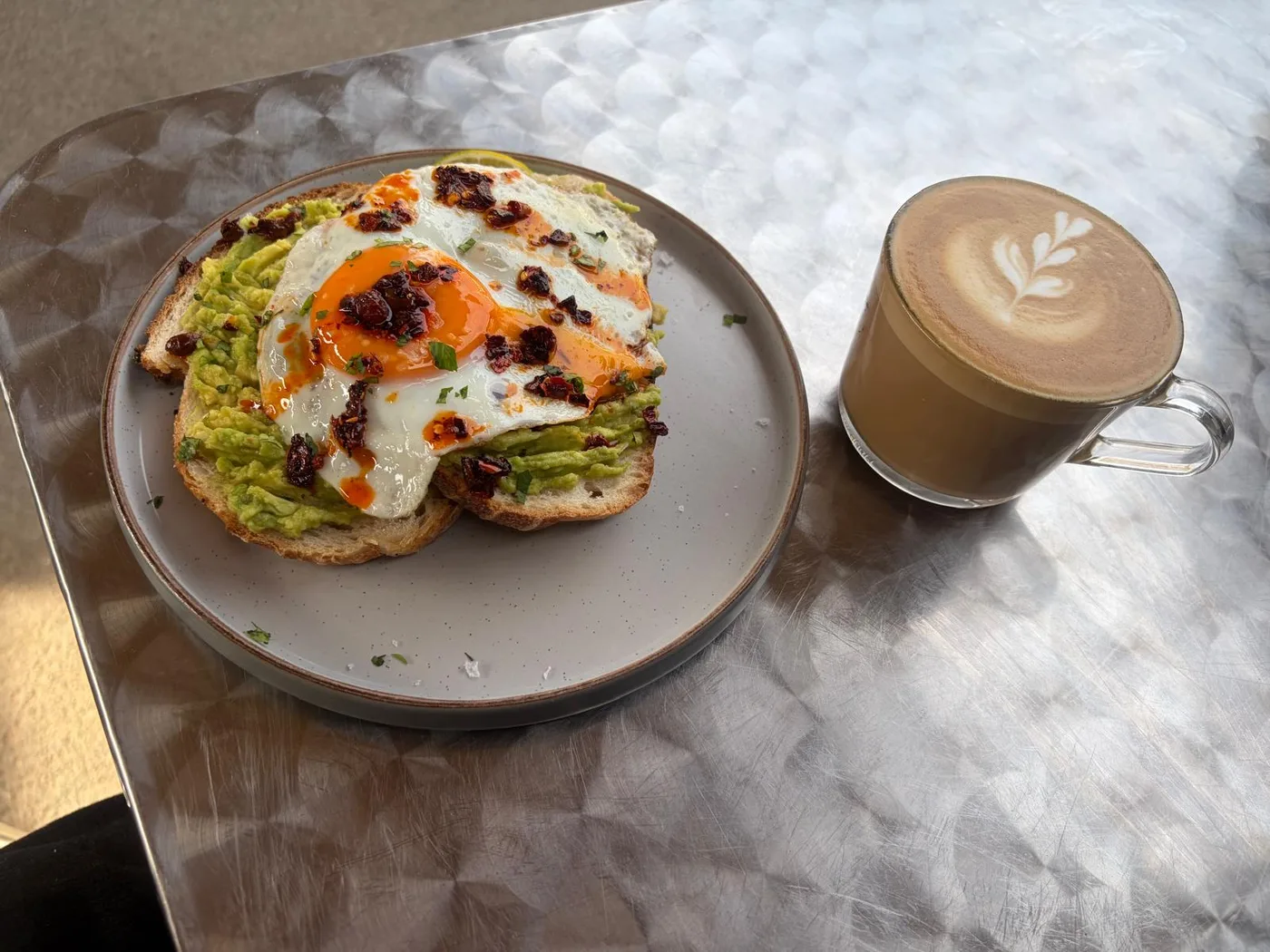 Avocado toast with eggs and coffee at Cabana in Westward Ho!
