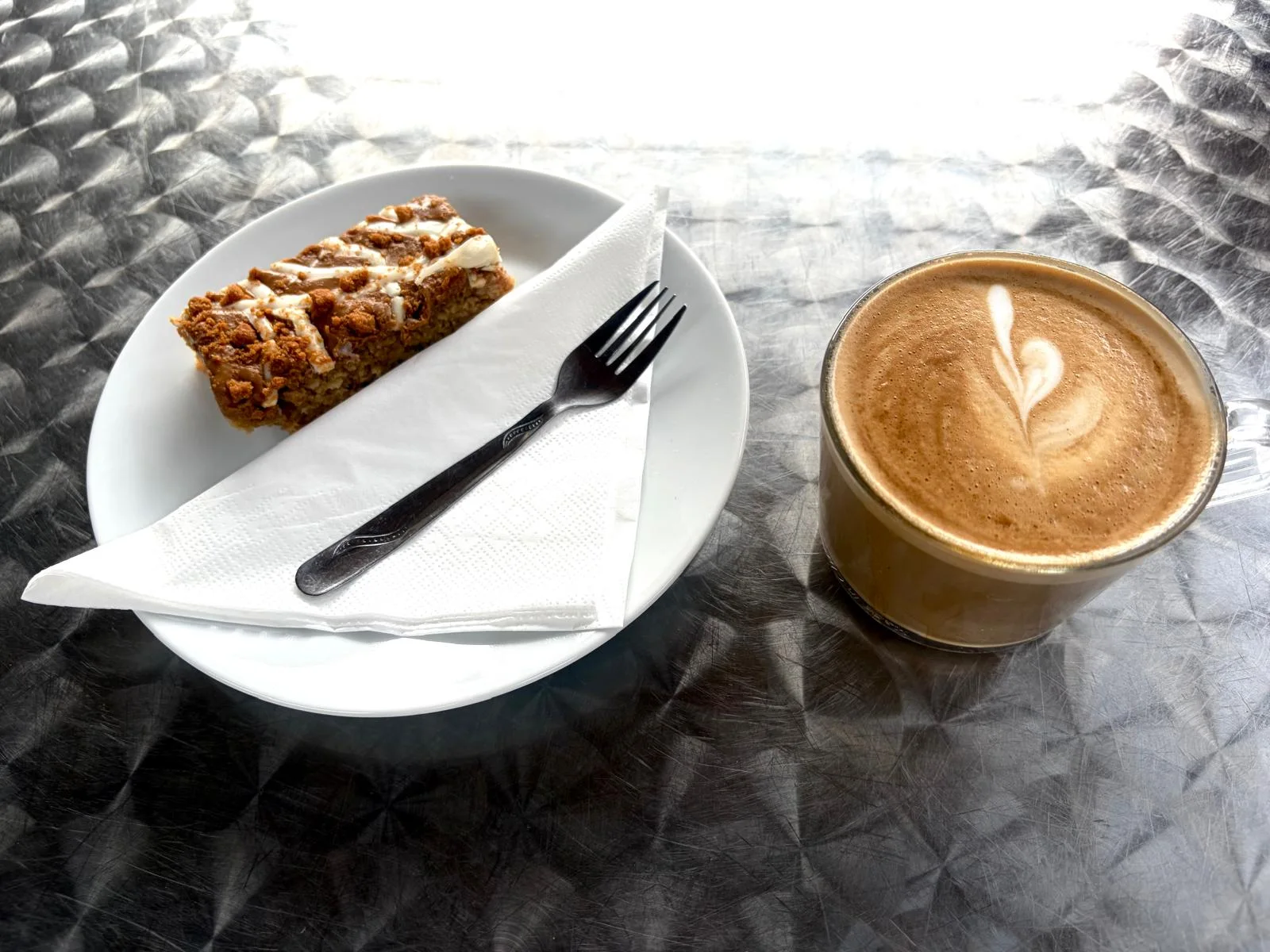 Flat white with a slice of cake at Cabana in Westward Ho!