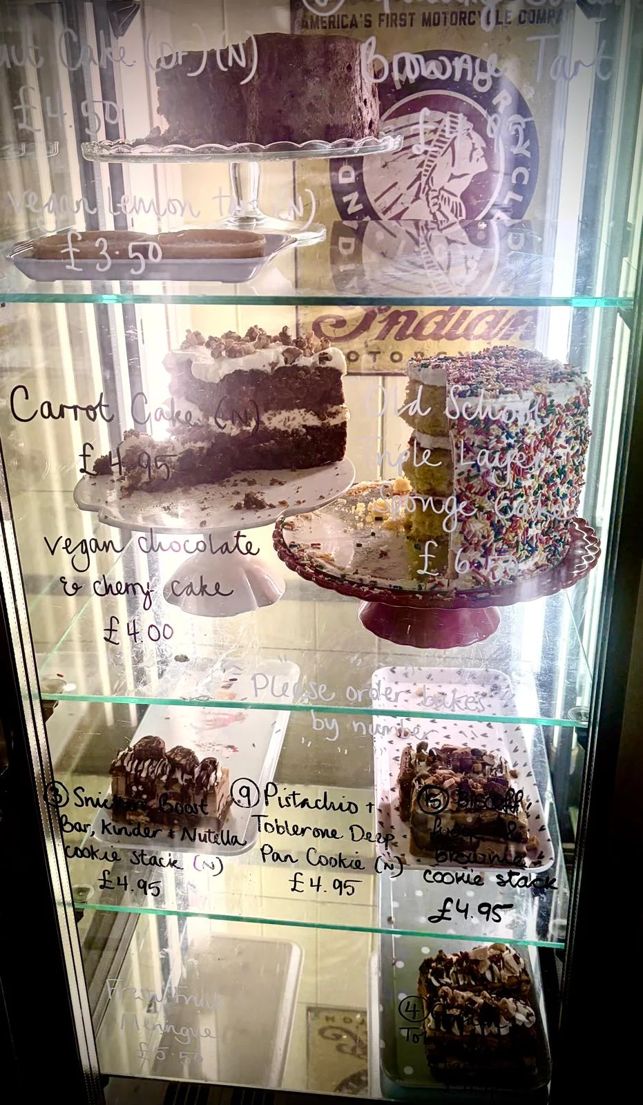 Slices and whole cakes displayed inside Tea on the Green