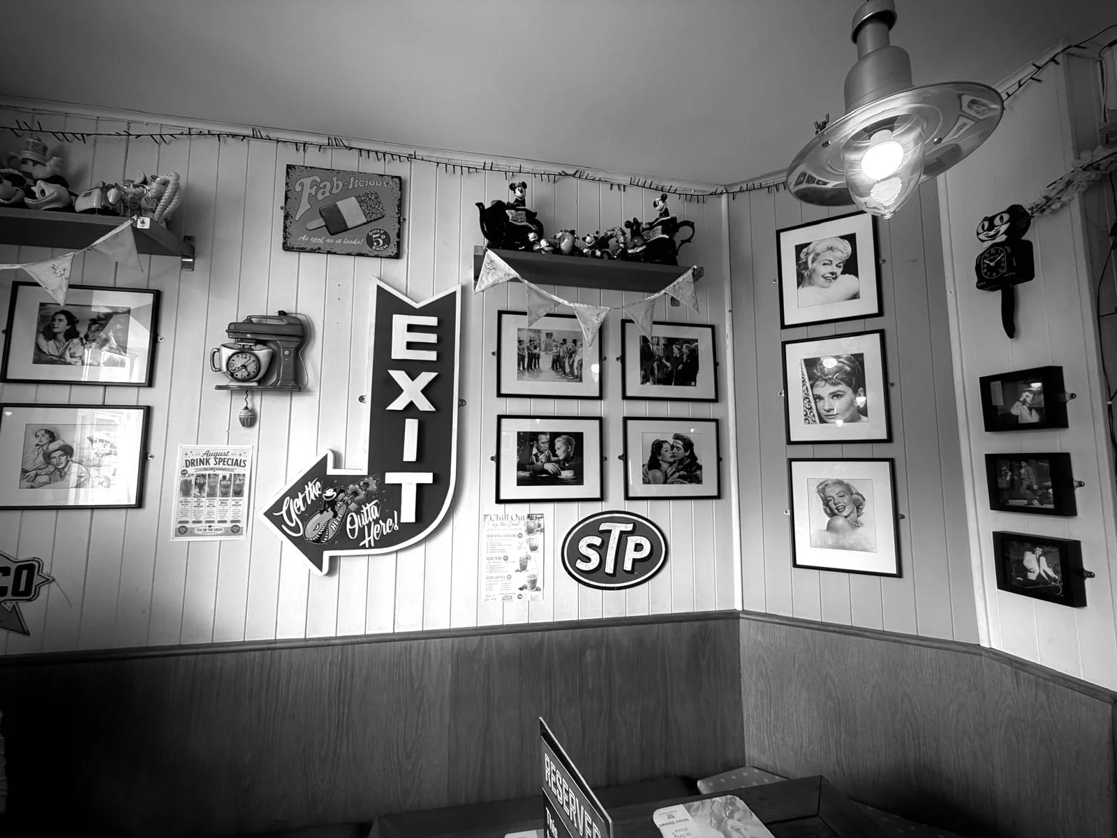 Tea on the Green interior with framed film photographs and retro memorabilia