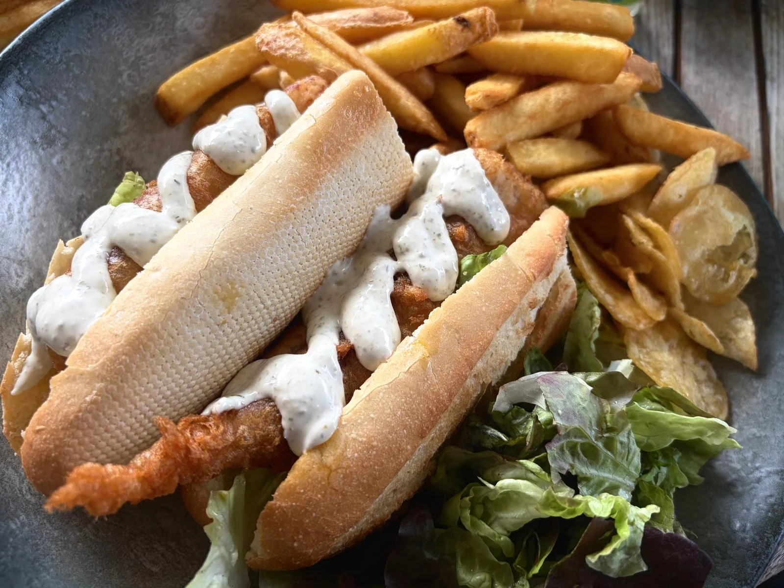 Cod goujon baguette with chips and salad at The Waterfront Inn