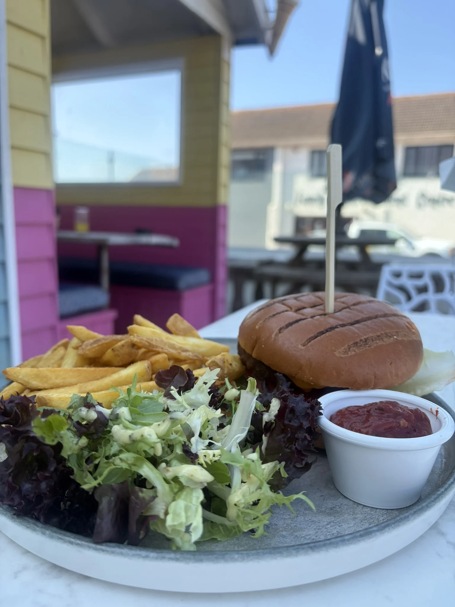 Burger with chips, salad and coleslaw at The Waterfront Inn