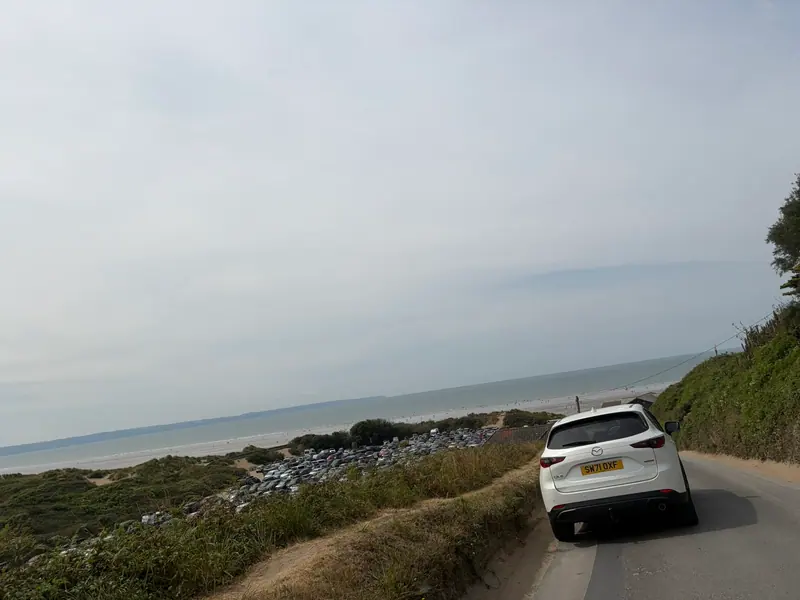 The coast road down to Saunton Sands with the dunes and sea beyond
